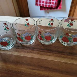 four vintage juice glasses marked on bottom